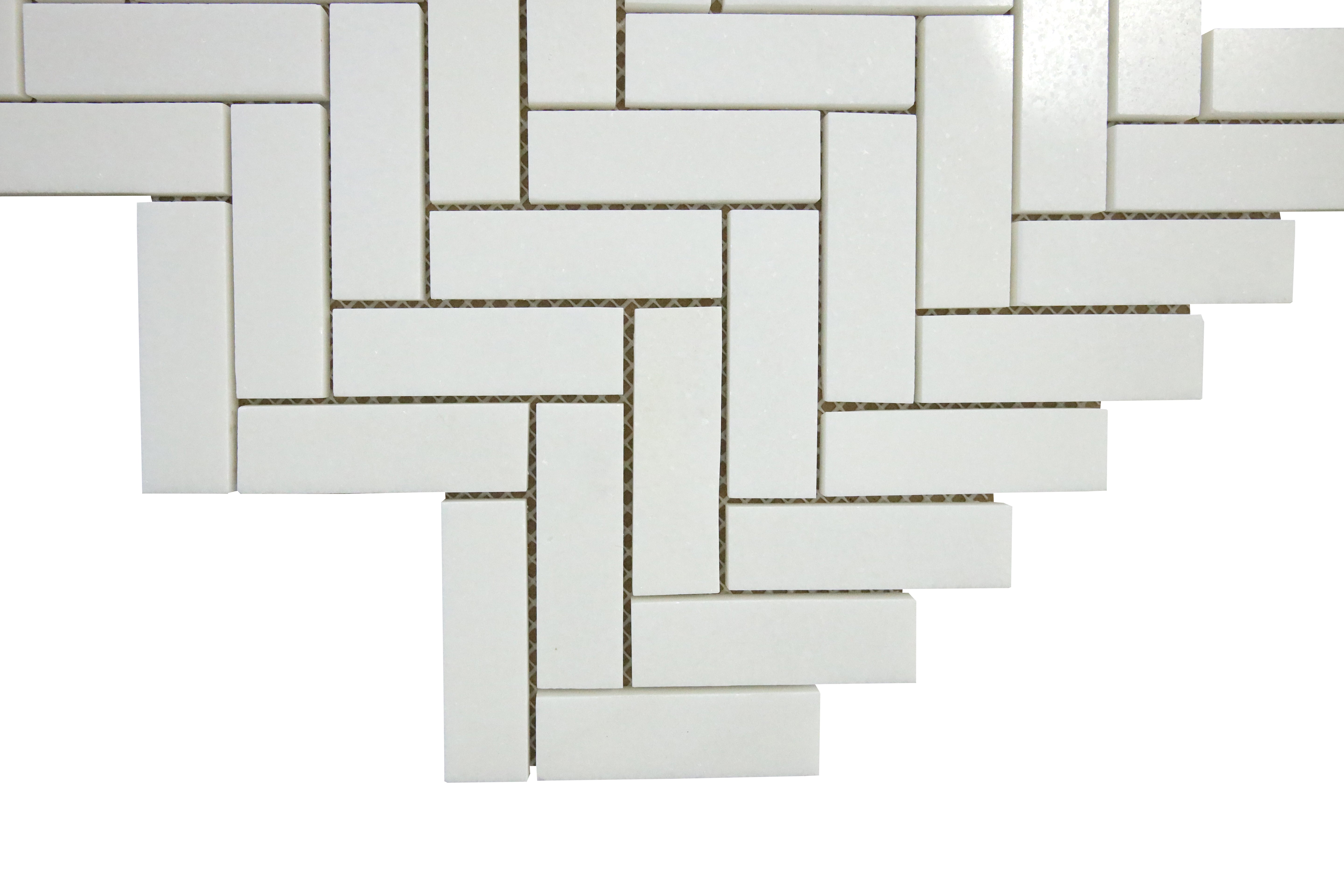 Close-up of polished Thassos marble herringbone mosaic tile