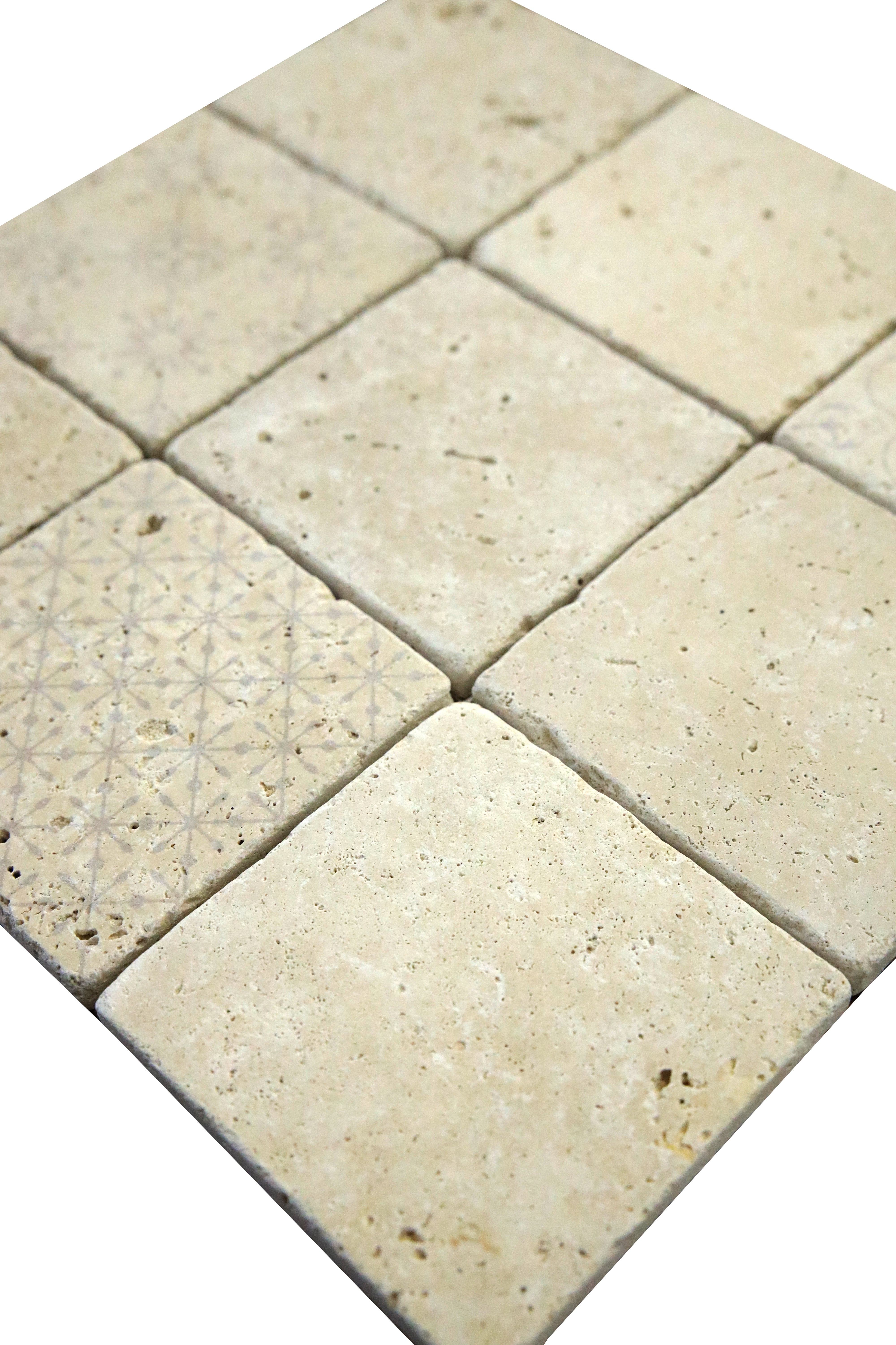 Close-up detail of decorative digital print on tumbled ivory travertine tile