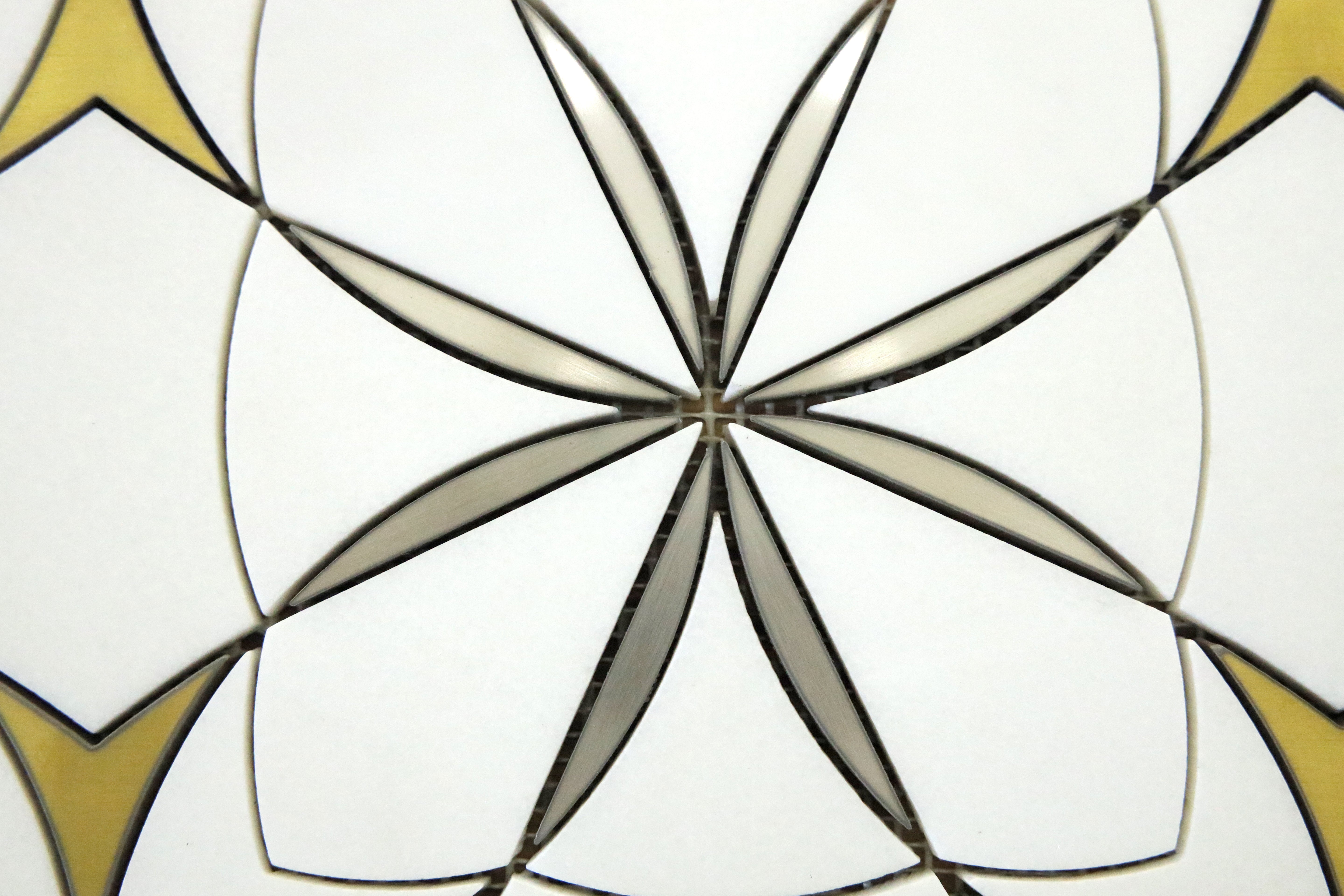 Waterjet Monaco Thassos brass mosaic tile installed on a luxury bathroom wall